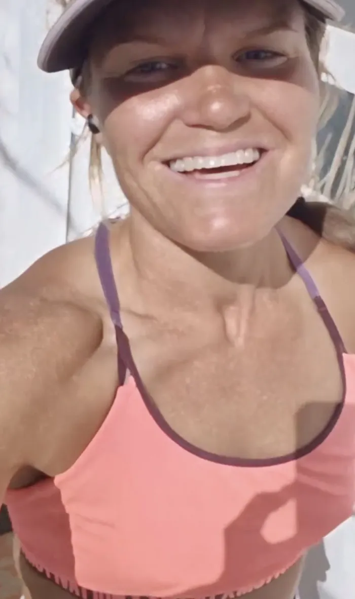 Emma smiling in the sun after training
