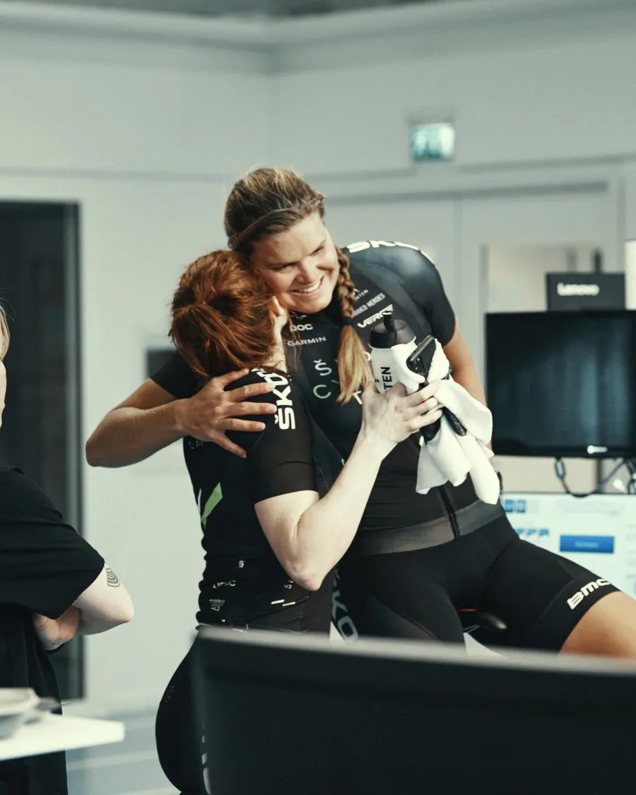 Emma hugging a teammate after a lab test